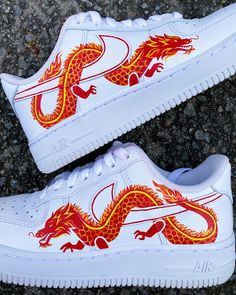 Unique, custom-made shoes with a red dragon design wrapping around the Nike swoosh! Each pair is hand-painted with high-quality Angelus leather paint and sealed with a waterproof finisher to protect against fading, cracking, or chipping. The listed price includes the cost of the Nike Air Force 1 shoes ($90) plus the cost of the artwork. If you would like another time of shoe, such as an off-brand shoe at a lower price, please message me and I can adjust the price for you! Your shoes will take up Air Force One Shoes, Air Force 1 Shoes, Painted Nikes, Nike Air Force 1 Custom, Custom Painted Shoes, Custom Shoes Diy, Diy Sneakers, Nike Shoes Air Force, Painted Sneakers