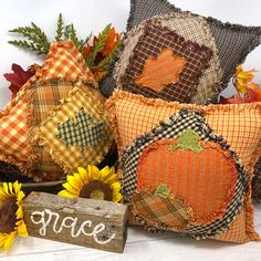 decorative fall pillows with pumpkins and sunflowers