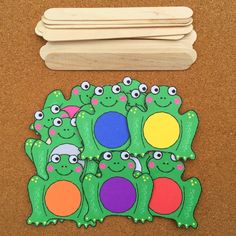 several pieces of paper cut out to look like alligators with different colors and shapes