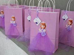 purple bags with princesses on them are lined up