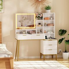 a white desk topped with a mirror next to a plant and a potted plant