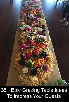 a long table covered in lots of different types of food on it's sides