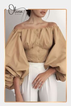 Experience the perfect blend of elegance and comfort with its waist-slimming design and solid color palette. Elevate your style game today! #FashionMustHave #OliviaMark #ShirtStyles #WomensFashion Khaki Blouse, Crop Top Styles, Dorothy Dandridge, Lantern Sleeve Top, Lantern Sleeved Blouses, Puff Sleeve Shirt, Off Shoulder Shirt, Backless Crop Top, Retro Mode