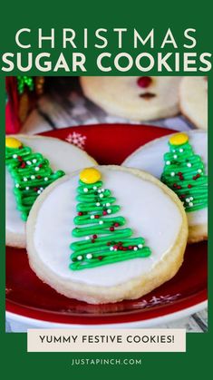 christmas sugar cookies on a red plate with green icing and trees in the middle