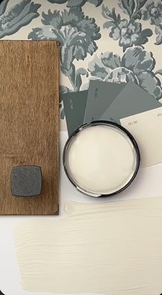 a table with some paint samples and a mirror