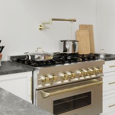 a stove top oven sitting next to a counter with pots and pans on it