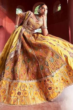 Mustard yellow jamawar attached cancan panelled lehenga in floral geometric pattern with resham, zari and pearl hand embroidery. Paired with a matching padded blouse embellished with resham, pearl and zari embroidery, dupatta in shimmer tissue base with zari border and embellished belt. - Aza Fashions Transitional Yellow Lehenga With Cutdana, Transitional Yellow Choli With Dupatta, Traditional Yellow Reception Dress, Traditional Yellow Anarkali Set With Motifs, Traditional Yellow Anarkali Set With Meenakari, Traditional Yellow Meenakari Anarkali Set, Yellow Sets With Motifs For Transitional Season, Transitional Yellow Sets With Motifs, Yellow Anarkali Set With Motifs