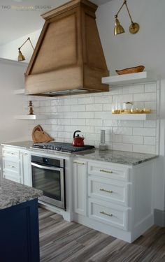 a stove top oven sitting inside of a kitchen