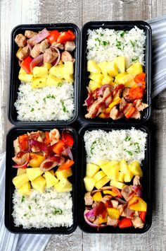 four plastic containers filled with rice, meat and veggies on top of a wooden table