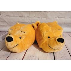 a pair of winnie the pooh slippers