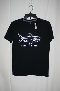 OLD NAVY BOYS BLACK "KEEP IT MOVING" SHARK SHORT SLEEVE SHIRT SIZE XL (14-16) MADE IN GUATEMALA APPROXIMATE MEASUREMENTS: ARMPIT TO ARMPIT ~ 17" TOP OF SHOULDER TO BOTTOM HEM ~ 25" NWT ITEM IS FROM A SMOKE FREE HOME :)  THANKS FOR LOOKING AT ANOTHER FAB FIND!!! LIVE LIFE FAB Casual Black Glow In The Dark Top, Keep It Moving, Navy Boys, Live Life, Guatemala, Short Sleeve Shirt, Art Ideas, Sleeve Shirt, Old Navy