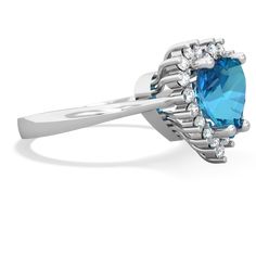 This luxurious and majestic 14K White Gold ring features a large and brilliant heart shaped navy blue london topaz, surrounded by {diamondcarats}. We all know nothing says I love you more than a diamond, but perhaps twenty diamonds say it even louder. This very special ring is part of a set, which includes a matching ring and pendant, creating an ensemble that will bring a smile to her face and a glow to her heart. Luxury Lab-created Round Sapphire Ring, Luxury Lab-created Sapphire Solitaire Jewelry, Luxury Lab-created Sapphire Fine Jewelry, Luxury Lab-created Sapphire Birthstone Ring, Heart Halo Ring, London Topaz Ring, Alexandrite Jewelry, Blue Topaz Jewelry, Alexandrite Ring