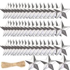 a bunch of paper airplanes that are next to some twine and string on a white background