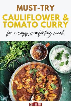 A rich cauliflower and tomato curry served with fluffy white rice and fresh herbs on a rustic green background.