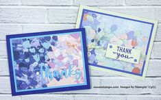 two cards with thank you written on them, one is blue and the other is purple