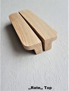 two wooden spoons sitting on top of each other