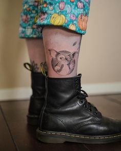 a person with a tattoo on their leg