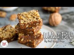 three pieces of walnut bar sitting on top of a white plate