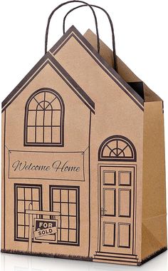 a brown paper bag with a small house on it's front and the words welcome home