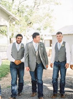 three men in vests and ties are walking together