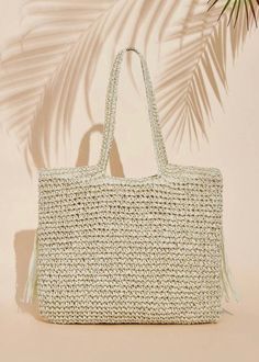 Expertly crafted with a woven design, this shoulder tote bag is both stylish and functional. The addition of fringe detailing adds a touch of elegance while providing extra storage space for your belongings. The versatile beige color makes it the perfect accessory for any outfit. Beige Fringe Shoulder Bag For Daily Use, Rectangular Beige Bag With Fringe, Beige Fringed Tote Beach Bag, Chic Beige Fringe Shoulder Bag, Beige Fringe Tote Shoulder Bag, Extra Storage, Shoulder Tote Bag, Shoulder Tote, Beige Color