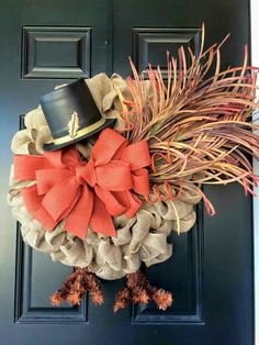 an image of a wreath made out of burlocks and bows on the front door