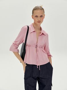 Editor's notesCardigan-type blouse with a string for a convenient and stylish front tie fastening. The color and material combine for a glossy shine.- Stretchable jersey material- Nickel hook allows various stylish- Button on sleeves- Available in two colors: Pink/NavyMeasurements(in.)S / M- Shoulder: 15.35 in. / 15.94 in.- Chest: 18.11 in. / 19.09 in.- Waist: 16.93 in. / 17.72 in.- Armhole: 7.68 in. / 8.07 in.- Sleeve Length: 22.83 in. / 23.22 in.- Sleeve Open: 3.54 in. / 3.94 in.- Length: 20.4 Chic Long Sleeve Tops With Drawstring, Fall Top With Drawstring Tie, Chic Drawstring Top For Fall, Vintage Pink Tops With Button Closure, Vintage Pink Button-up Blouse, Pink Stretch Button-up Top, Pink Long Sleeve Top With Soft-washed Detail, Pink Button-up Tops With Button Closure, Men Shoes Size