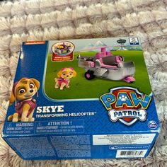 the paw patrol skye transforming helicopter playset is in its box