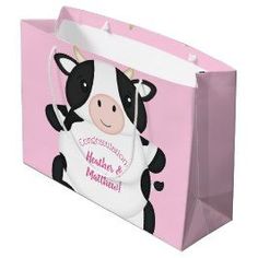 a pink shopping bag with a black and white cow on it's chest, saying congratulations to health & nutrition