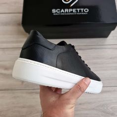 Experience luxury and comfort with these gorgeous Black Genuine Leather Sneakers. Crafted with premium genuine leather, these sneakers feature a high sole that looks stunning and provides unbeatable support. Step into style with these stunning shoes! Sporty Leather Shoes With White Sole And Round Toe, Sporty Leather Shoes With Round Toe, Low-top Leather Shoes With Textured White Sole, Custom Sneakers With Stitched Sole And Round Toe, Sporty High-top Platform Sneakers With Leather Sole, Luxury High-top Sneakers With Rubber Sole, Modern Slip-on Sneakers With Contrast Sole, Low-top Platform Sneakers With Leather Sole For Streetwear, Leather Shoes With White Contrast Sole And Round Toe