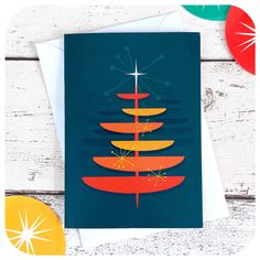 a christmas card with an image of a surfboard in the shape of a tree