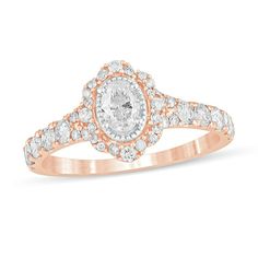 Celebrate every wonderful moment of your love with this vintage-inspired diamond engagement ring. Created in 14K rose gold, this charming style showcases a 1/3 ct. diamond shimmering in a border of intricate milgrain. The scalloped frame and subtly split shank sparkle with multi-sized diamonds. Captivating with 1 ct. t.w. of diamonds and a bright polished shine, this engagement ring is bursting with romantic detail. Scalloped Frame, Antique Engagement Rings Vintage, Vintage Style Engagement Rings, Oval Diamond Ring, Antique Engagement Rings, Rose Gold Metal, Split Shank, Oval Diamond, Diamond Stone