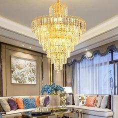 a living room filled with furniture and a chandelier hanging over it's head