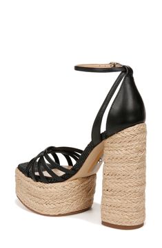 Crisscrossing vamp straps lend modern dimension to an espadrille-inspired sandal lofted by a jute-wrapped platform and soaring block heel. 5 1/4" heel Adjustable ankle strap with buckle closure Leather upper/synthetic lining/rubber sole Imported Straw Ankle Strap Sandals For Party, Ankle Strap Straw Sandals For Party, Straw Ankle Strap Heels For Party, Party Sandals With Ankle Strap In Straw, Party Ankle Strap Straw Sandals, Black Straw Heels For Spring, Party Heels With Woven Straw Sole, Spring Black Straw Heels, Party High Heel Straw Heels