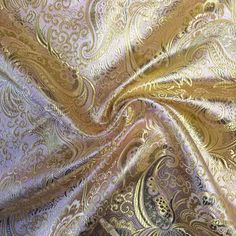 a gold and white paisley print fabric