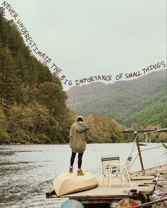 a man standing on top of a boat in the water