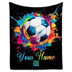 a soccer ball with paint splatters on it and the words your name written in front