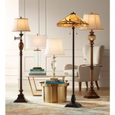 three lamps are sitting next to each other on the floor