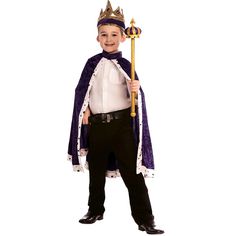 a little boy dressed in a king costume with a crown and holding a staff on his shoulder