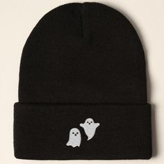 a black beanie with two ghost faces on it