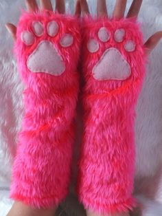 "CHOICES: Primary Colour is for the glove faux fur colour Secondary Colour is for the fleece paw pads Description: Pair of gloves made from fluffy faux fur fabric in a colour of your choice with fleece paw pads.   (Variation pictured is primary colour Hot Pink, secondary colour Pink). These gloves are fingerless which make them possible to wear every day, as well as part of a costume, since you still have full use of your hands as well as adorably sweet paws. These are an extra long version of my best-selling gloves - instead of ending at the wrist, these gloves are elbow length for extra warmth and furriness!  The approximate flat measurements of these gloves are 13\" long, 4.5\" across widest part of hand and 5\" wide across widest part of forearm. These gloves are one size fits most as Fingerless Long Gloves, Dog Bear, Silly Clothes, Costume Gloves, Bear Paw, Paw Pads, Long Gloves, Bear Paws, Faux Fur Fabric