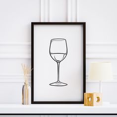 a black and white drawing of a wine glass on a shelf next to a lamp