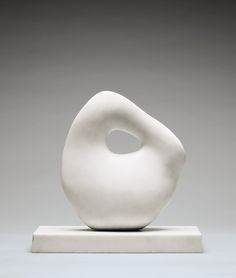 a white sculpture sitting on top of a table