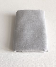 a plain gray cloth on a white surface