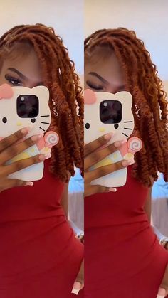 a woman with dreadlocks taking a selfie in front of her cell phone