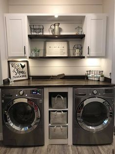 a washer and dryer in a laundry room with shelves above the washer