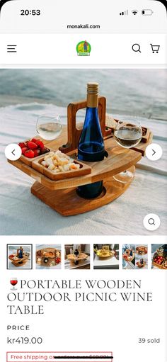 a wooden tray with food and wine on it