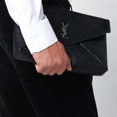 Black grained lambskin Saint Laurent clutch bag featuring a flap closure with magnetic button, an internal flat pocket and front logo. Width 30 cm x Height 20 cm x Depth 5 cm Size Type: INTMaterial: LeatherSKU: 778181AACIA/P_YSL-1000_100 Our Products Are 100% Genuine. In All Cases We Stand By The Authenticity Of Every Product Sold On Our Site. Designer Textured Leather Clutch For Business, Designer Textured Leather Business Clutch, Designer Black Envelope Clutch, Leather Envelope Clutch With Dust Bag, Luxury Black Clutch For Workwear, Luxury Black Clutch For Work, Black Business Clutch With Magnetic Closure, Saint Laurent Clutch, Black Envelope