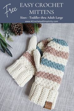 a knitted mitten sitting on top of a table next to pine cones