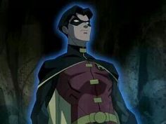 an animated image of a man in a suit and cape standing next to a cave